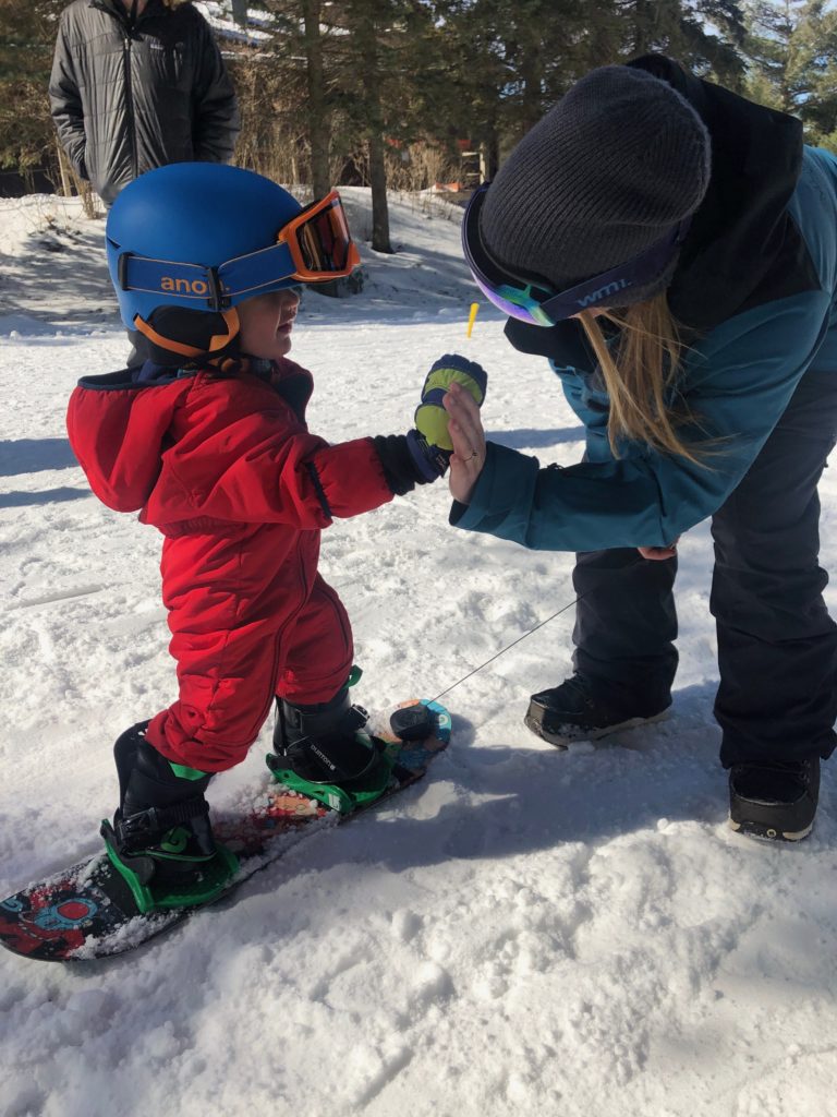 Sliding Sideways with Toddler Snowboard Lessons - All Mountain Mamas