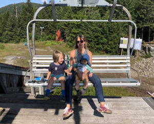 family on ski lift in summer at Bolton Valley