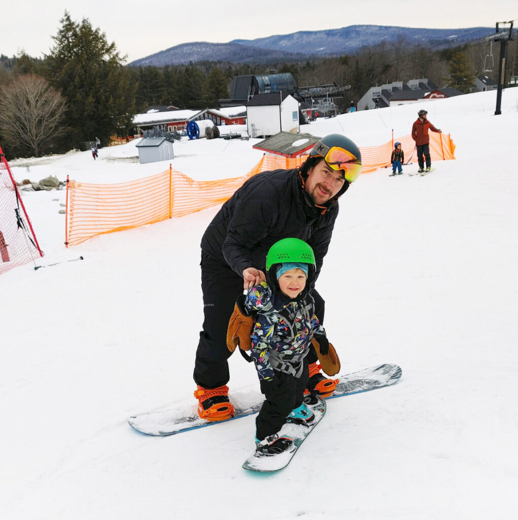 Father and son snowboarding at Magic Mountain