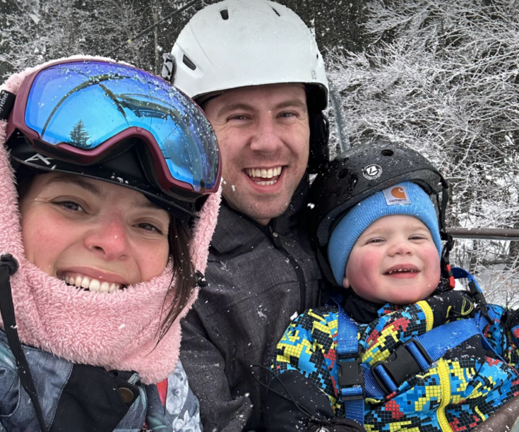 Snowboarding family on the lift