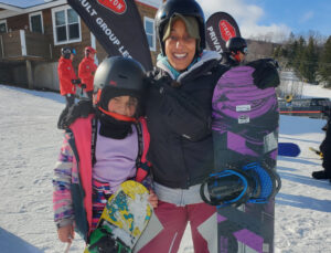 mom and daughter snowboarding at stratton