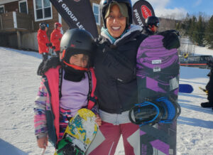 mom and daughter with snowboards at Stratton, Vermont