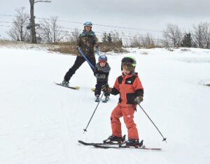 family skiing at the Hermitage Club