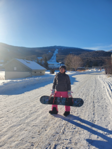 young girl on a snowboard adventure at Killington in Vermont