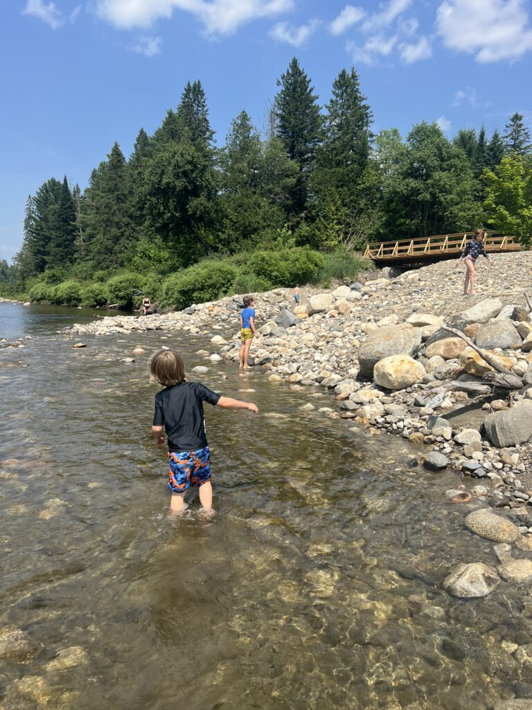 Kids play in river in East Burke, Vermont