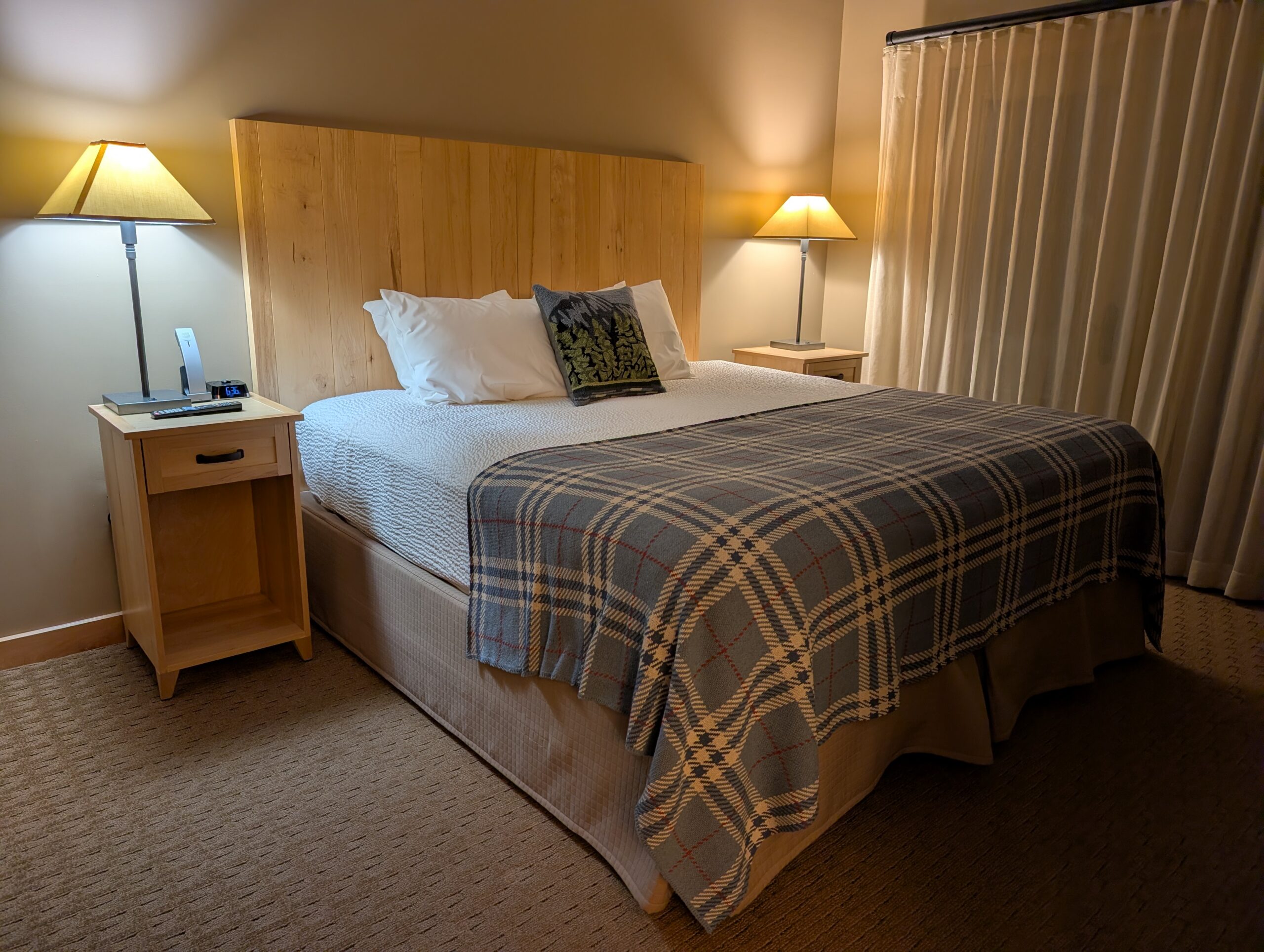 Bed in room at Burke Mountain Hotel