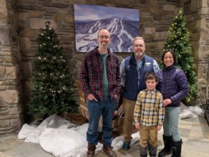 Family with Burke Hotel valet in lobby